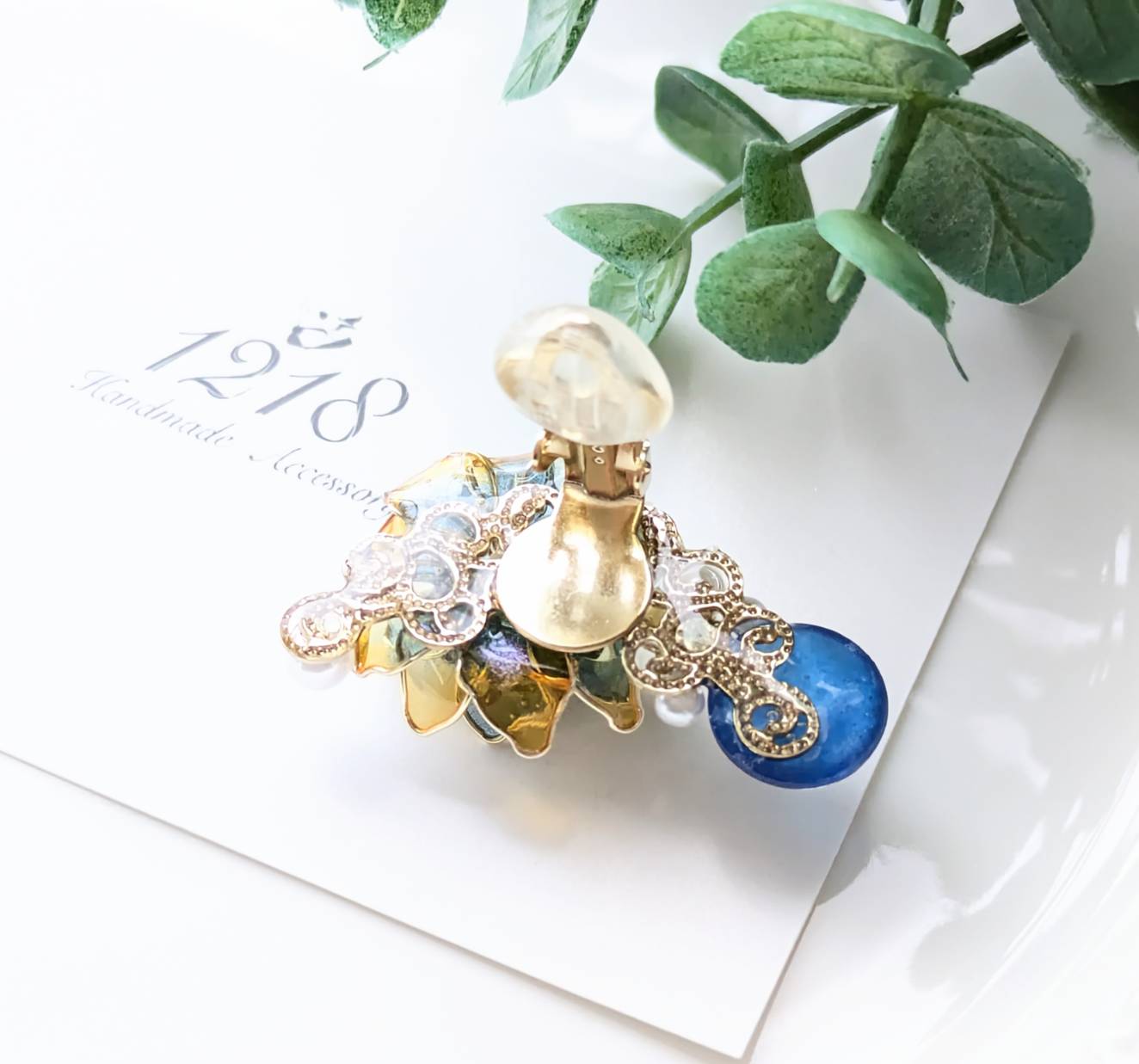 夕焼けから晴天夜へ色変わる花 イヤーカフ