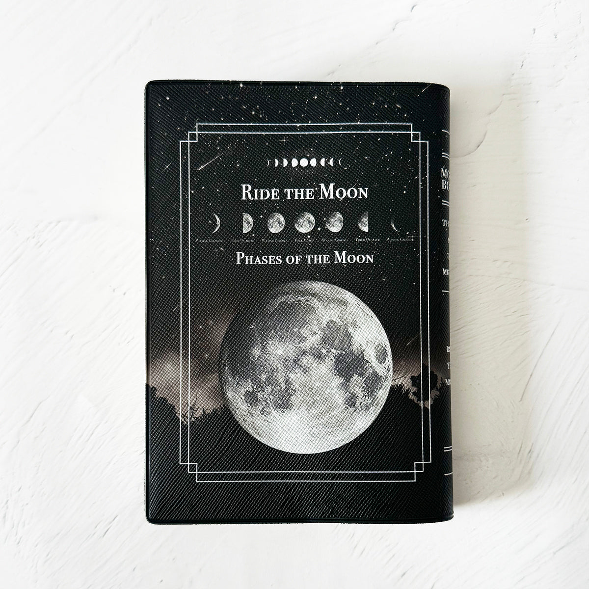 【ブックカバー】月の事柄が描かれた本のようなブックカバー RIDE THE MOON