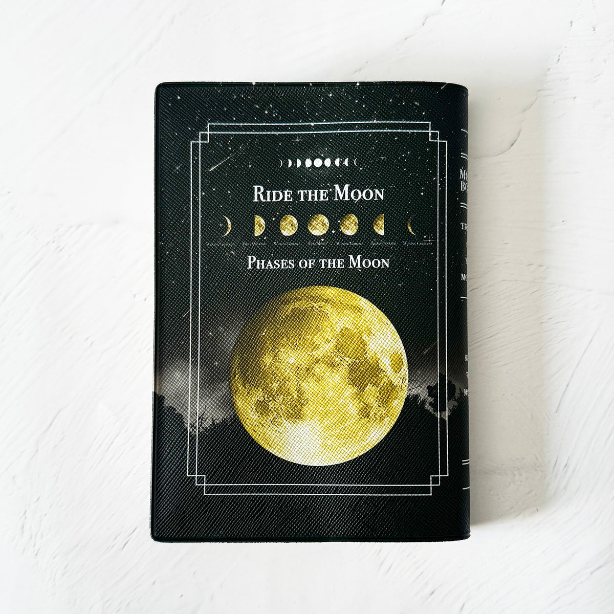 【ブックカバー】月の事柄が描かれた本のようなブックカバー "RIDE THE MOON"