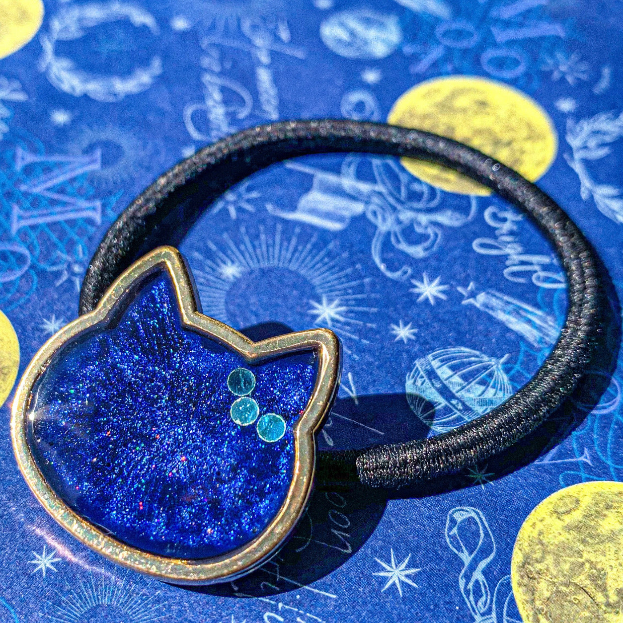 ねこ顔ヘアゴム お星様を耳飾りに 〜 – 宙フェス夜市